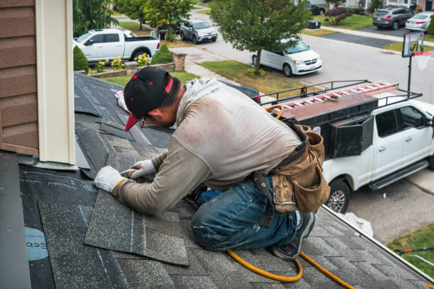 Professional Roofing technician working in Plainville, NY